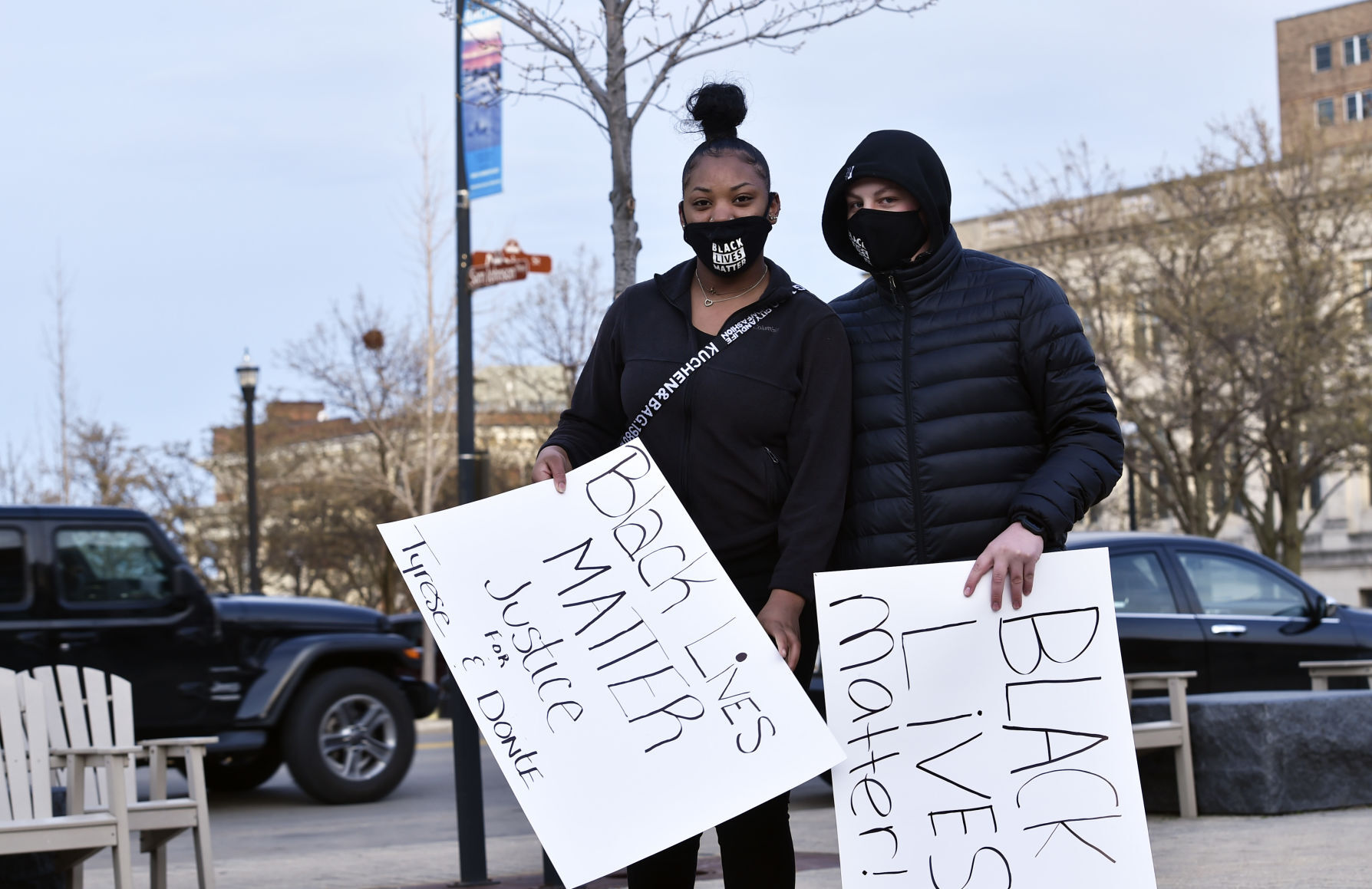 Teenagers carrying Black Lives Matter signs